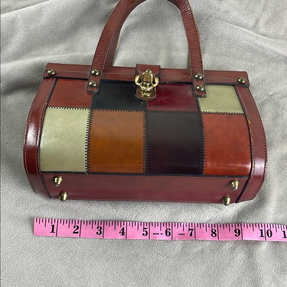 Vintage Brown Satchel with Structured Design and Metal Accents - Picture 13 of 15